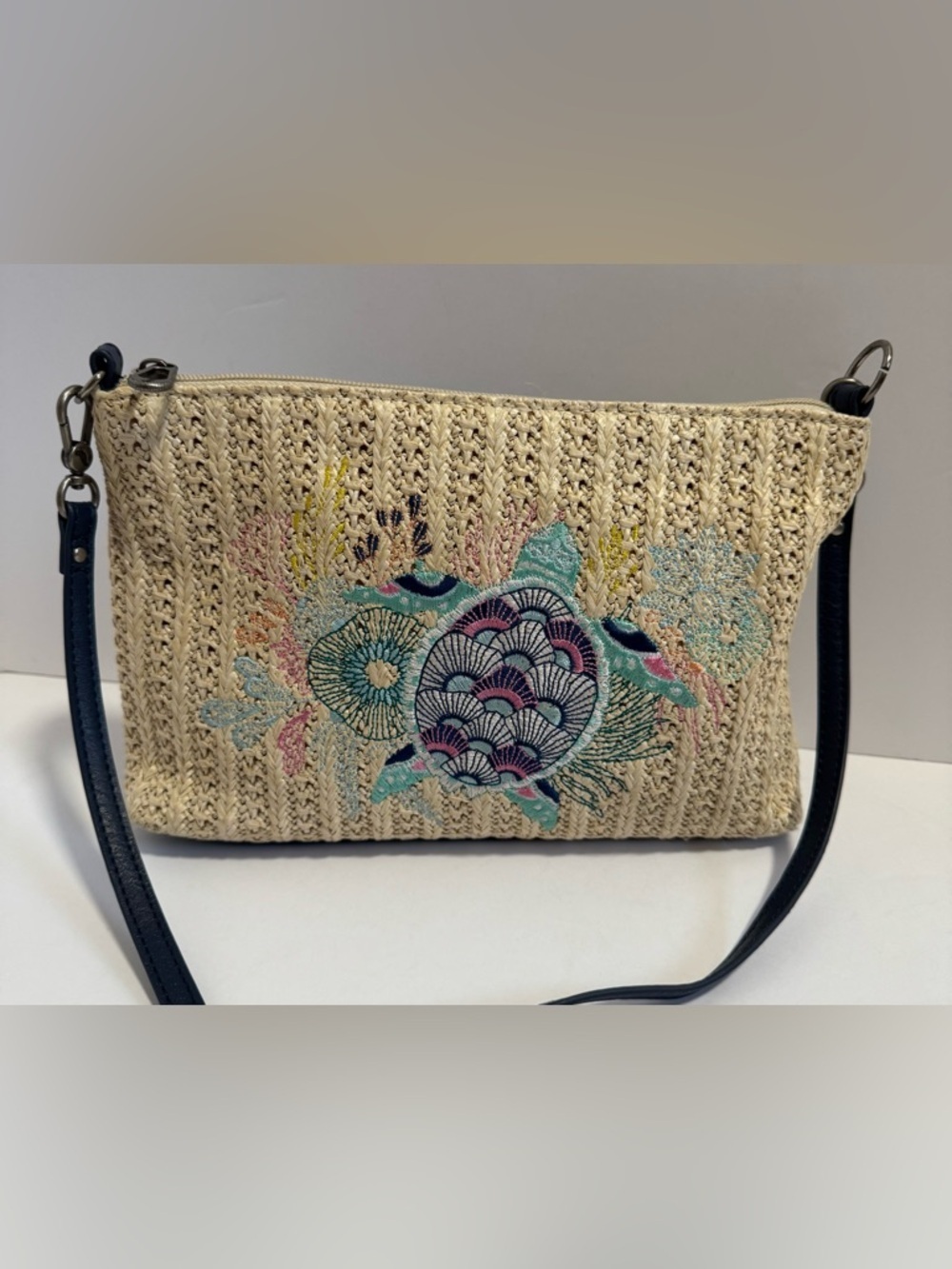 Sakroots Lumi Convertible Crossbody Purse woven with a Turtle